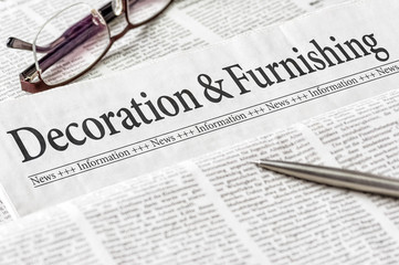 A newspaper with the headline Decoration and Furnishing