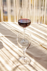 a glass of red wine on the table in the restaurant