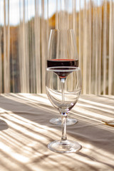 a glass of red wine on the table in the restaurant