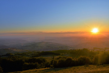 Naklejka na ściany i meble sunset over the hills and valleys in Transylvania