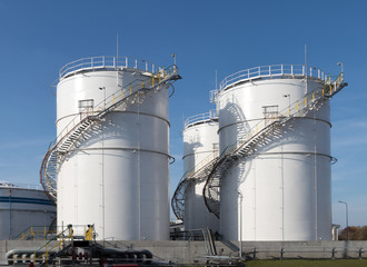 Industrial oil product storage tanks at the oil product terminal