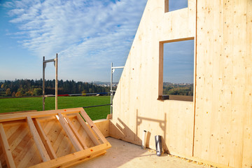 Construction of a wooden house, which are a more ecological and economic alternative than homes made of traditional brick and concrete