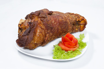 fried pork leg cooked on background