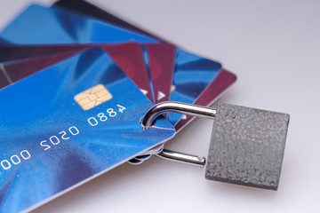 Bank or credit card with pad lock. Safe payment system with chip. Padlock and plastic card.