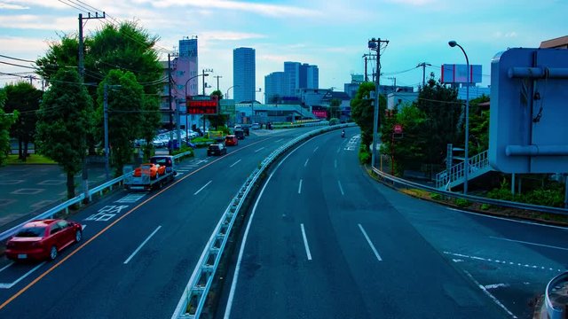 A timelapse of downtown street at Kanpachi avenue in Tokyo daytime wide shot zoom