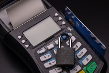 POS terminal, Payment Machine with credit card on black background.