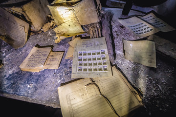 Old stamps and documents in ruined post office in Krasne, small village located in Chernobyl exclusion area, Ukraine