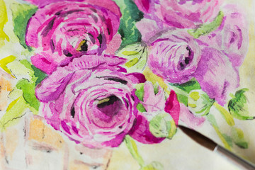 The watercolor drawing of Ranunculus flower in pink color in sketchbook with palette and brushes around