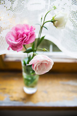 beautiful bouquet of pink and white flowers are on windowsill