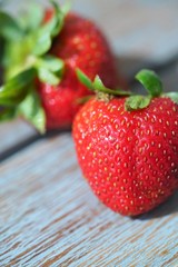 fresh wild strawberries on wooden table