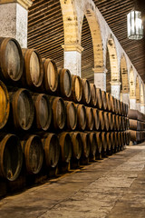 Production of fortified jerez, xeres, sherry wines in old oak barrels in sherry triangle, Jerez la Frontera, El Puerto Santa Maria and Sanlucar Barrameda Andalusia, Spain