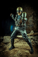 Naklejka premium Soldier woman with the bomb on post apocalyptic background.