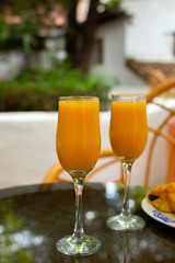 Healthy breakfast with two glasses of freshly squeezed orange juice