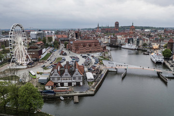Fototapeta na wymiar Aerial view on Motlawa river in Gdansk with amber sky wheel.