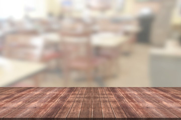 Wooden table with blur restaurant background