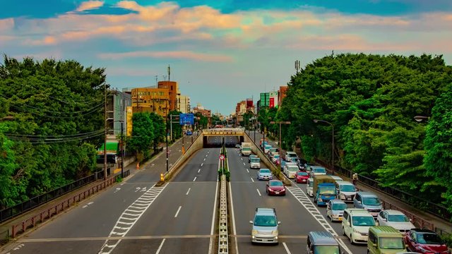 A timelapse of downtown street at Kanpachi avenue in Tokyo daytime wide shot zoom