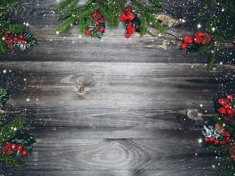 christmas background with decorations and snow on wooden board