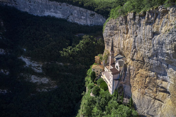 Fototapeta na wymiar Panorama view of Madonna della Corona, Italy. Flight by a drone. Popular travel destination in Nothern Italy.