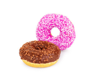 Delicious donuts with sprinkles on white background