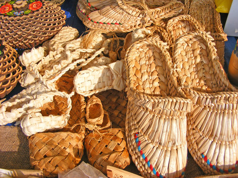 traditional bast shoes hanging at russian souvenir market