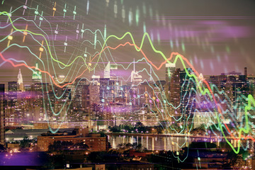 Double exposure of forex chart drawings over cityscape background. Concept of success.