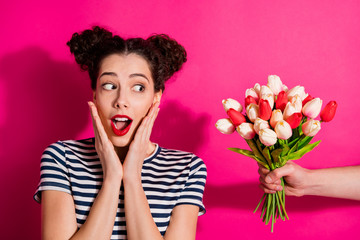 Close up photo of shocked girl got bunch of fresh green tulips gift for spring anniversary event...