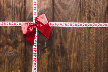 Composed holiday background with bow and ribbon