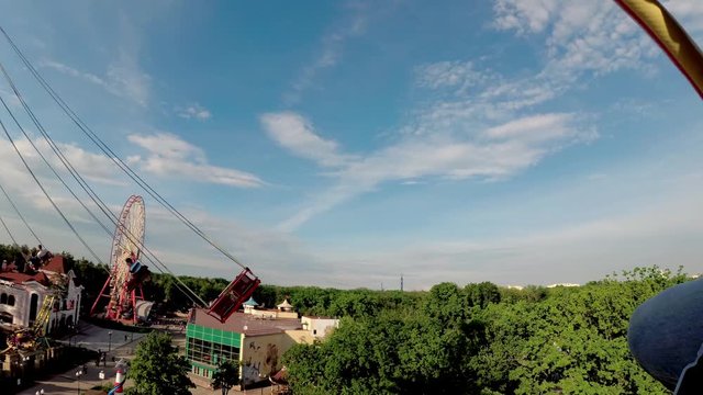Flying swing attraction in the amusement park