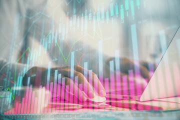 Double exposure of forex graph with man working on computer on background. Concept of market analysis.