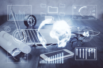 Stock market chart hologram drawn on personal computer background. Double exposure. Concept of investment.