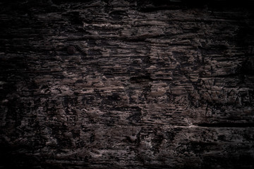 Texture old dark brown wood with scuffs and cracks. Vintage background from old board