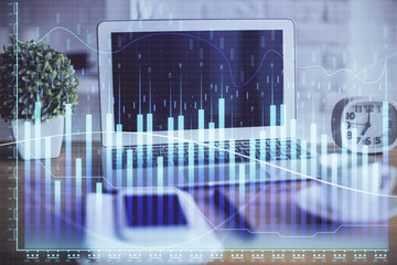 Forex market chart hologram and personal computer background. Multi exposure. Concept of investment.