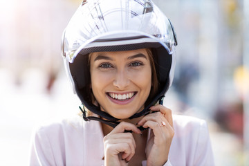 Beautiful young woman wearing helmet