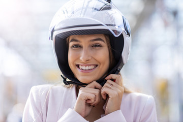 Beautiful young woman wearing helmet