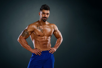 Fototapeta na wymiar Handsome Shirtless Muscular Men Posing and Flexing Muscles