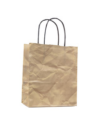 Brown crumpled paper bag on white background