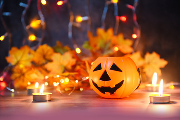 Halloween background candlelight orange decorated holidays festive concept - funny faces jack o lantern pumpkin halloween decorations for party accessories object with candle light bokeh