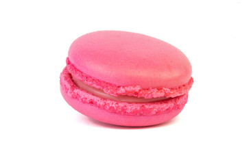 Pink macaroon coockie isolatd laying on a table.