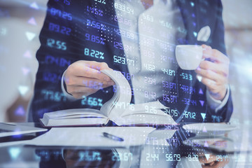 Double exposure of businessman with coffee with stock market forex chart.