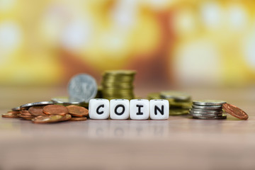 Pile of Golden coin, silver coin and copper coins on table money financial