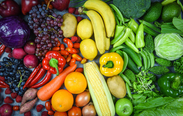 Fototapeta na wymiar Assorted fresh ripe fruit red yellow purple and green vegetables mixed selection various / vegetables and fruits background healthy food clean eating for heart life cholesterol diet health