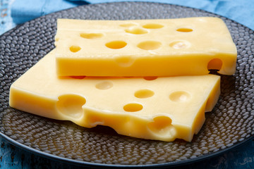 Two blocks of French emmental semi-hard cheese