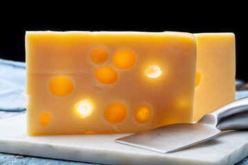 Two blocks of French emmental semi-hard cheese
