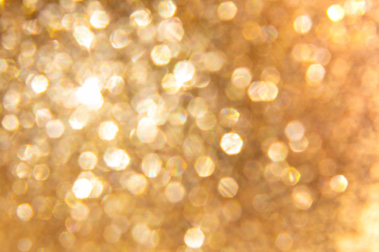 abstract background with small seized gold bokeh