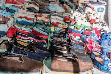Exhibition of slippers in street market