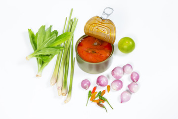 mackerel in tomato sauce with vegetable on background