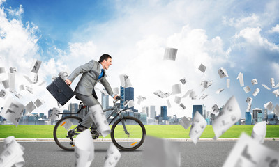 Accountant wearing business suit riding bicycle