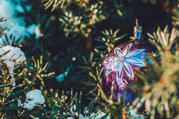 Obraz na płótnie Canvas Christmas tree in Christmas balls, choked with snow in the Ukrainian village