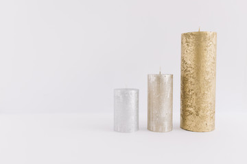 Three different candles on table