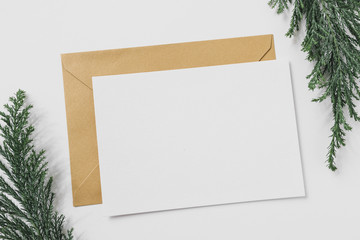 Sheet of paper with yellow envelope on table